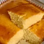 Delicious corn bread side piece cut on top of bread