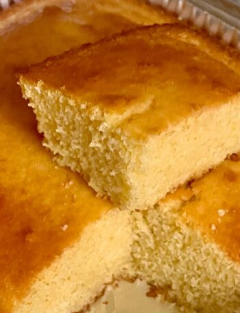 Delicious corn bread side piece cut on top of bread